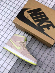 Sneaker displayed beside a Nike shoebox, showing the high-top silhouette and beige and neon yellow-green color scheme.