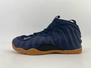 Navy blue high-top sneaker with a gum-colored outsole.