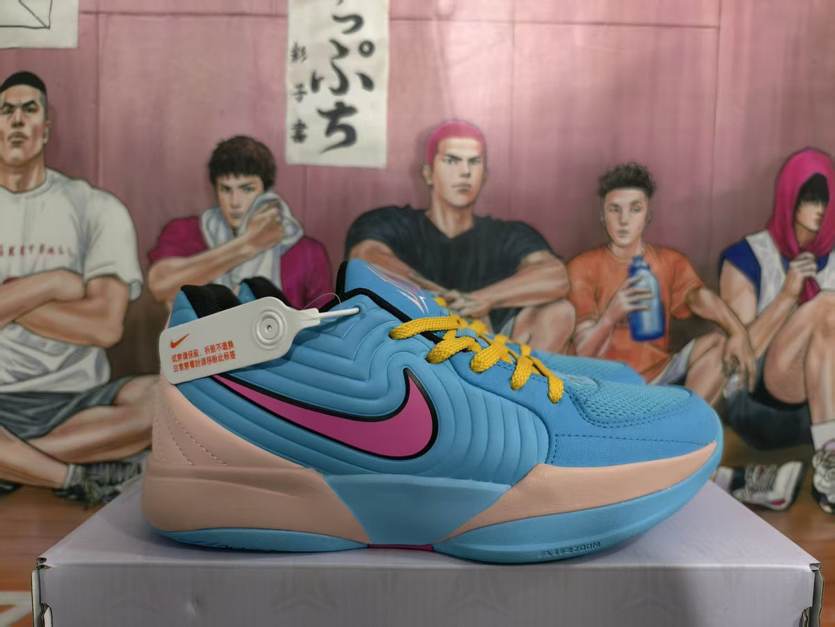 Side view of blue Nike basketball sneakers with pink Swoosh detailing, peach panels, and yellow laces.