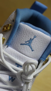 Close-up of the tongue with blue Jordan branding and white laces.