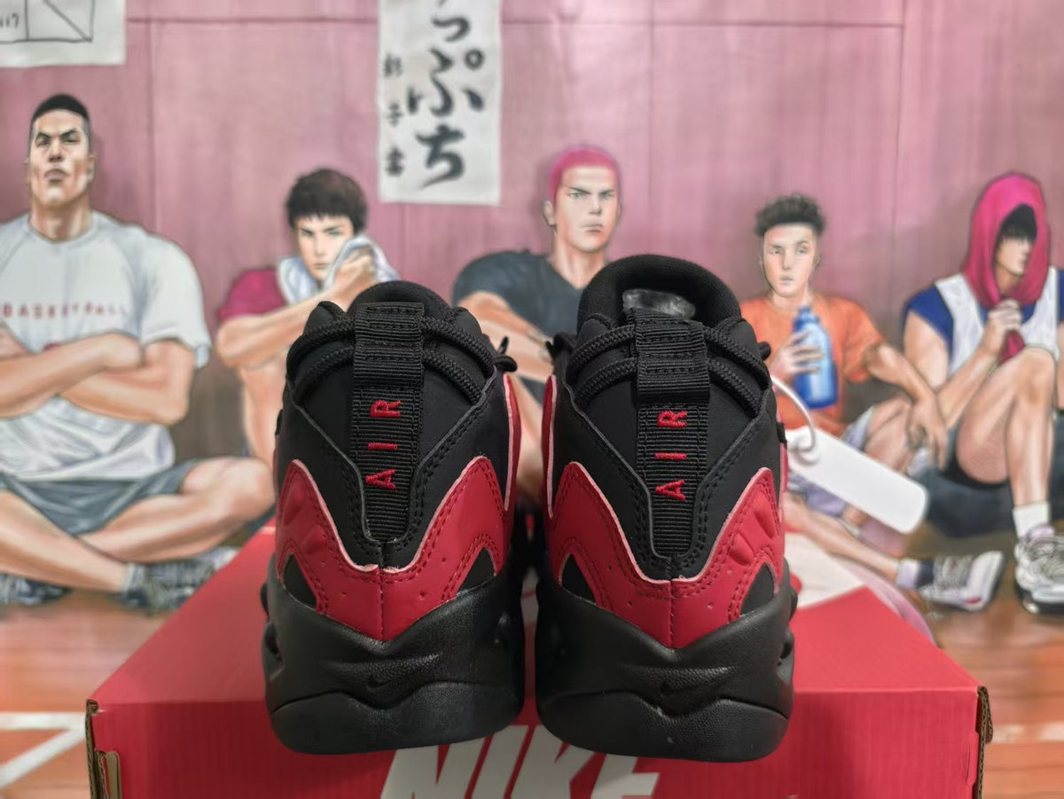 Rear view of black and red Nike sneakers showing padded collars, heel panels, and black outsoles.