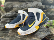 Close angled view of Nike Kobe 2K5 upper, ankle strap, and yellow accents