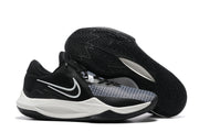 Black and white basketball shoe with a white side accent and black patterned outsole.