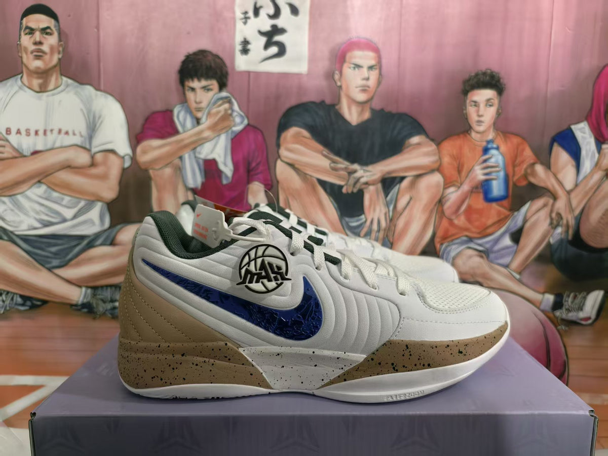 Side view of white Nike basketball sneakers with dark blue Swoosh accents, tan heel panels, and a speckled midsole on a shoebox.