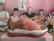 Side view of a magenta low-top sneaker with layered panels, contrasting toe detail, and a white sculpted midsole.