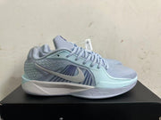 Side view of a light blue Nike Sabrina 2 shoe with a contrasting Swoosh and patterned panels
