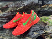 Angled view of the red textured upper and green swoosh on Nike Kobe 6 shoes