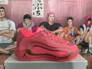 Side view of a pink Jordan basketball sneaker showing layered panels, a metallic-gold accent, Jumpman branding, and Cushlon text near the outsole.