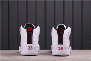 Rear view showing black heel pull tabs, red-and-black Jordan branding, and number 23 details.