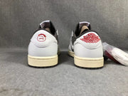 Rear view of the pair showing white heel panels, red heel graphics, and cream-colored midsoles.