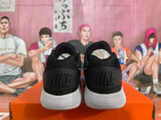 Rear view showing black Nike heel panels and white ridged soles.