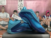 Angled side view of a pair of blue Nike basketball sneakers displayed on a shoebox.