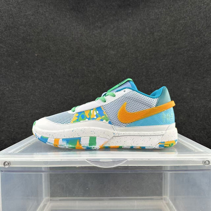 Side view of a blue, white, and yellow low-top Nike sneaker with green laces and a multicolored outsole.