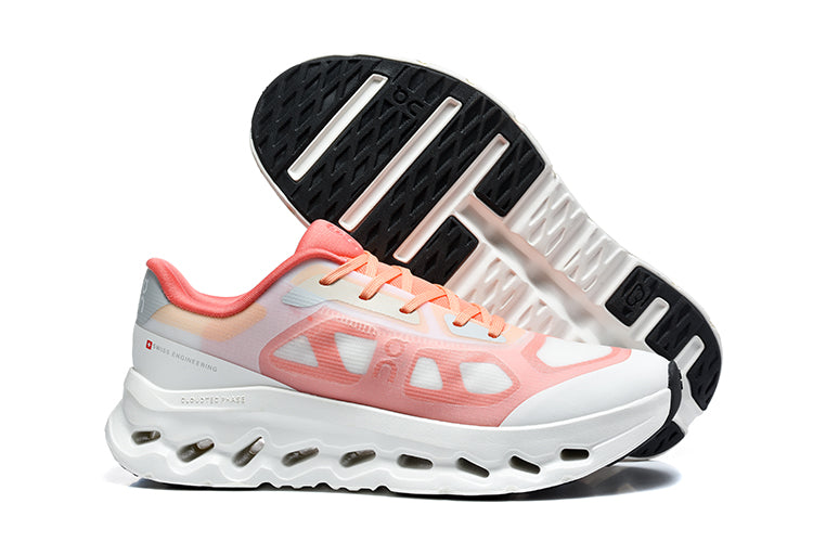 Side view of white and coral On Cloudtilt Remx sneakers, with one shoe showing the black-and-white outsole.