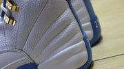 Close-up of the textured side panels, stitching, and gold-tone lace hardware.
