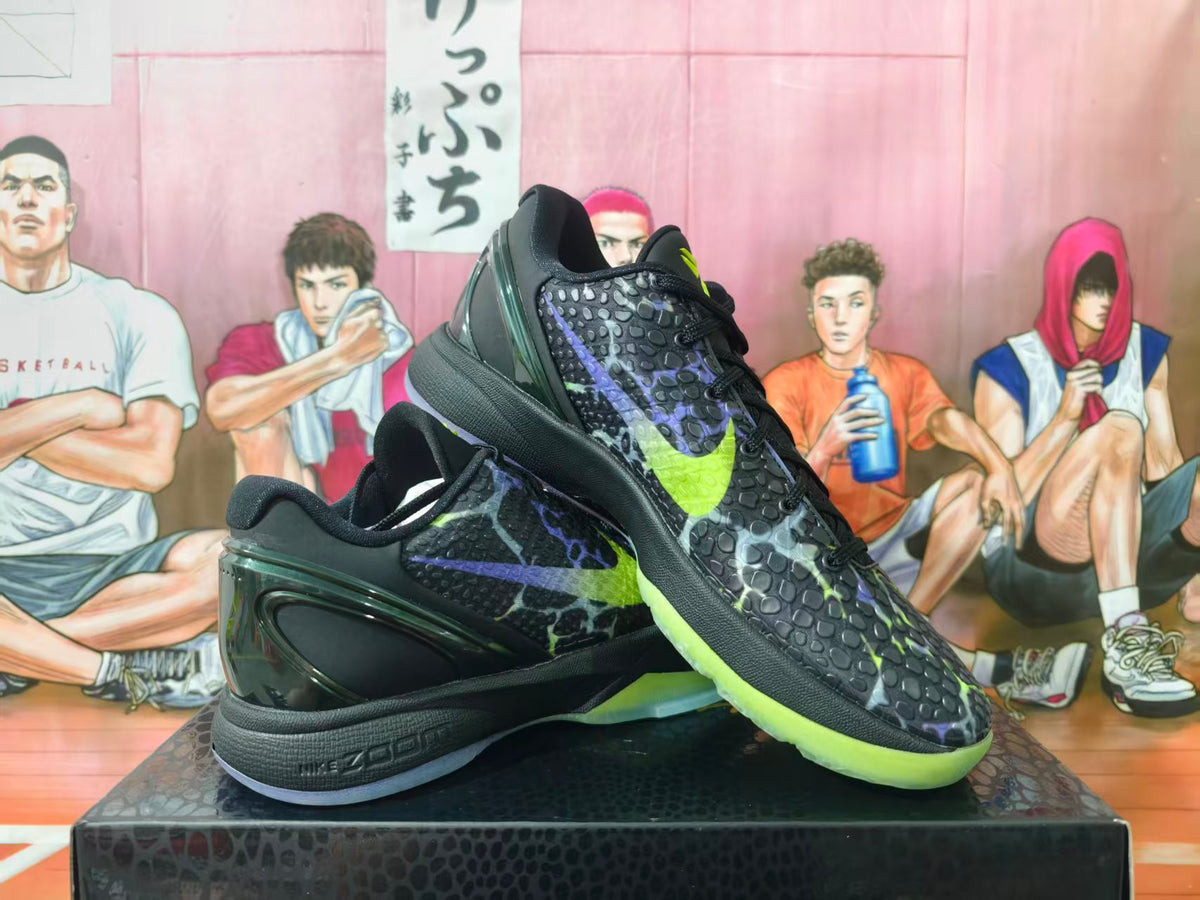 Nike Kobe basketball shoes in black with purple and volt-green accents, shown at an angle.