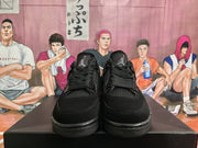 Front view of black high-top sneakers showing the Jumpman tongue logos, woven mesh panels and black laces.