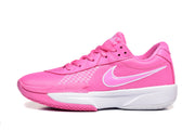 Side profile of a pink Nike sneaker showing the white Swoosh and layered white midsole.