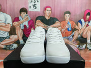 Front view of white lace-up Nike Kobe basketball shoes