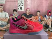 Side view of a pink and orange basketball shoe with a black-and-silver logo