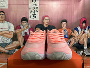 Front view of pink Nike basketball shoes with matching laces