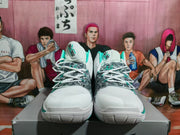 Front view showing the white toe boxes, patterned lace panels and Kyrie branding on the tongues.