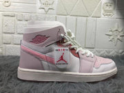 Side profile showing the ankle branding, attached hangtag, pink overlays, and white midsole.