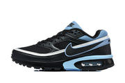 Side view of black Nike Air Max sneakers with light blue and white accents