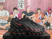 Side profile of a black Nike Air Max sneaker with dark red details