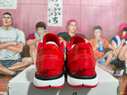 Rear view of the red Nike basketball sneakers showing padded collars, heel detailing, and white midsoles.