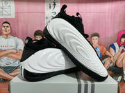 Black and white Adidas Harden Vol. 8 basketball shoes shown from the side and underside.