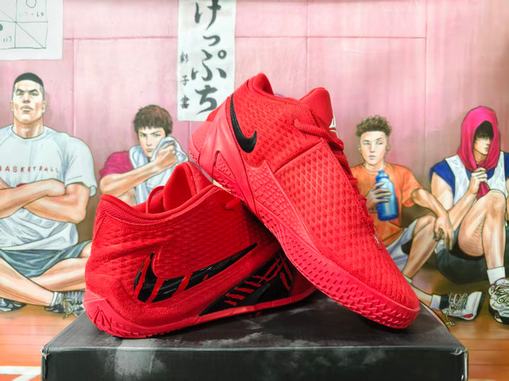 Pair of red basketball shoes with black side logos, shown from the side and above.