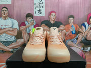 Front view of the pale pink and cream Nike Kobe 8 Protro basketball shoes with pink laces