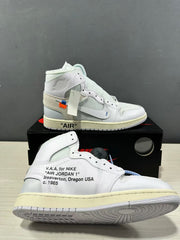 Side view of the white high-top sneaker showing the Swoosh detail, printed side text, and cream midsole.