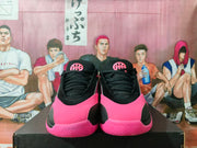 Front view of the pair showing black laces, pink toe panels, and Jordan tongue branding.