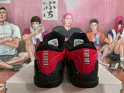 Rear view of red and black Nike basketball sneakers showing padded collars, contrasting heel details, and speckled black panels.