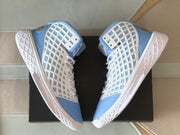Top-down paired view emphasizing the matching light blue and white colorway and structured side panels.