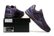 Dark purple Kobe 8 Protro shoes displayed with a shoe box.