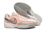Peach, white, and blue Nike G.T Cut Cross EP basketball sneakers shown with a textured outsole.