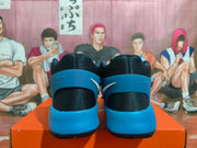 Rear view showing the black heel panels and blue heel supports.