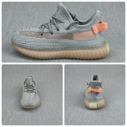 Collage showing side, front, and rear views of the gray and coral kids' sneaker.
