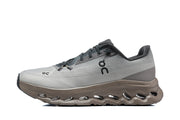 Side profile of a gray On Cloudmonster 3 sneaker with a sculpted taupe sole