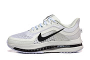 Side view of a white Nike Pegasus Premium shoe with black Swoosh and visible Air Zoom midsole.