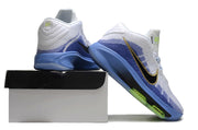 White and blue Nike GT Hustle 3 shoes posed on and beside a shoe box.