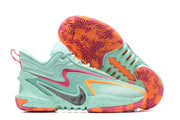 Aqua Nike Anthony Edwards 2 basketball shoes with pink and orange accents.