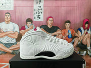Side profile of a white high-top sneaker with layered circular detailing and a black side insert.