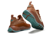 Brown sneaker pair showing the heel, outsole, and textured upper.