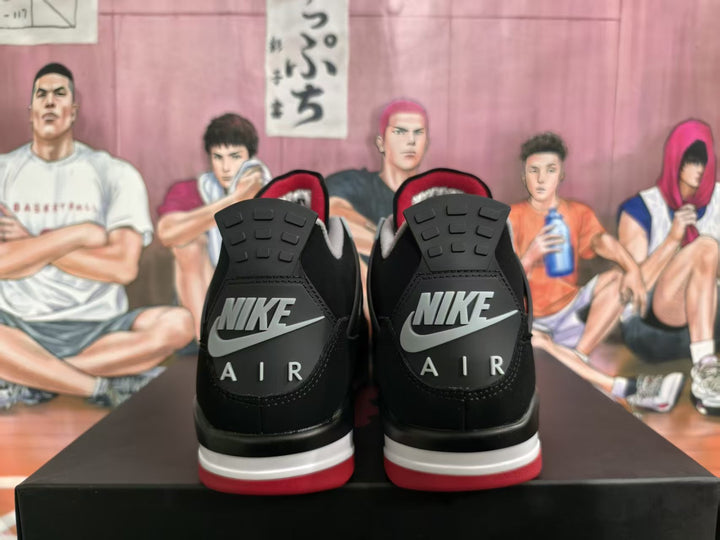 Rear view of black sneakers showing Nike Air heel branding, grey accents, and red outsole details.