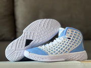 Pair of light blue and white basketball shoes showing the patterned outsole and side panels.