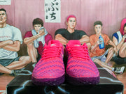 Front view of pink and purple basketball shoes with textured uppers